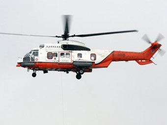 Вертолет Super Puma. Архивное фото AFP Вертолет Super Puma. Архивное фото AFP
