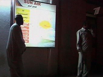 Представительство Sun Air в Ливии. Кадр местного телевидения, переданный в эфире Первого канала. Представительство Sun Air в Ливии. Кадр местного телевидения, переданный в эфире Первого канала.