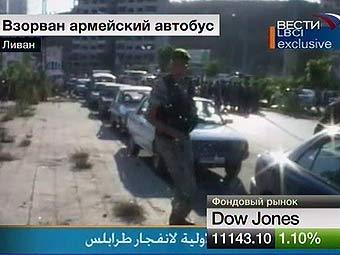 На месте взрыва автобуса в Триполи. Кадр ливанского телевидения, переданный телеканалом 'Вести 24'