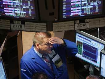 Трейдер на Нью-Йоркской фондовой бирже. Фото ©AFP