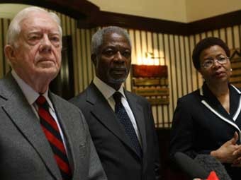 Картер, Аннан и Машел. Фото ©AFP