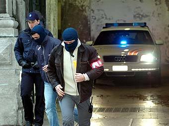 Сотрудники службы безопасности Бельгии. Фото (c)AFP Сотрудники службы безопасности Бельгии. Фото (c)AFP