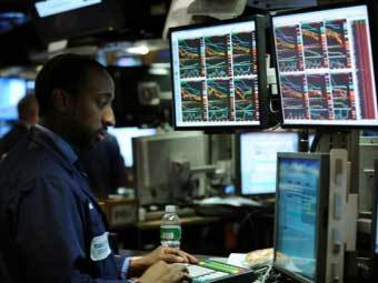 Трейдер на NYSE. Фото ©AFP 