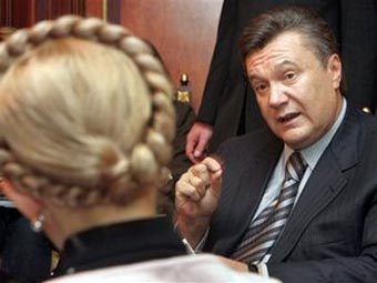 Юлия Тимошенко и Виктор Янукович. Фото ©AFP
