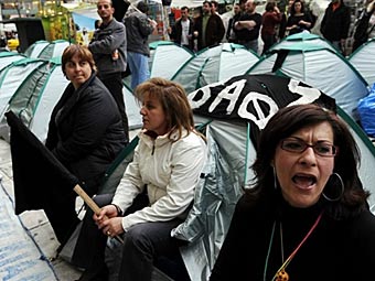 Акция протеста работников бюджетного сектора в Греции. Фото (c)AFP Акция протеста работников бюджетного сектора в Греции. Фото (c)AFP