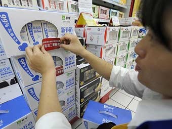 Молочные продукты в китайском гипермаркете. Фото (c)AFP Молочные продукты в китайском гипермаркете. Фото (c)AFP
