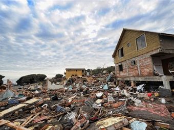 Последствия цунами в Чили. Фото (c)AFP Последствия цунами в Чили. Фото (c)AFP