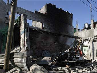 Последствия авиаудара по сектору Газа. Архивное фото (c)AFP Последствия авиаудара по сектору Газа. Архивное фото (c)AFP