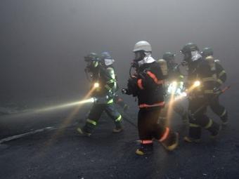 Южнокорейские пожарные. Архивное фото (c)AFP Южнокорейские пожарные. Архивное фото (c)AFP