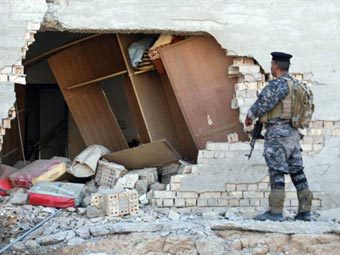 Место одного из взрывов в Тикрите. Фото (c)AFP Место одного из взрывов в Тикрите. Фото (c)AFP
