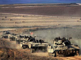 Колонна израильских танков. Фото (c)AFP Колонна израильских танков. Фото (c)AFP