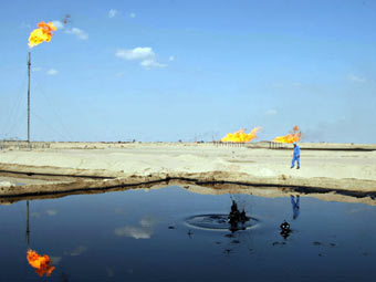 Нефтяное месторождение в Ираке. Фото (c)AFP Нефтяное месторождение в Ираке. Фото (c)AFP