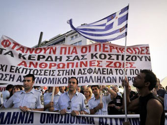 Акция протеста против экономической политики властей в Афинах. Фото (c)AFP Акция протеста против экономической политики властей в Афинах. Фото (c)AFP