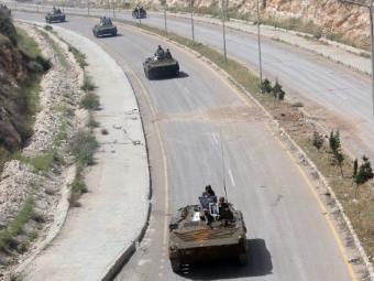 Сирийская бронетехника. Фото (c)AFP Сирийская бронетехника. Фото (c)AFP