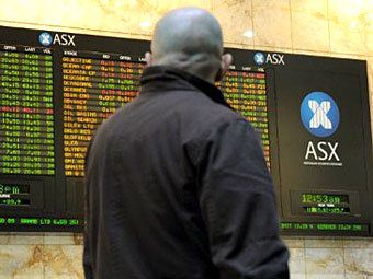 Информационное табло ASX. Фото (c)AFP Информационное табло ASX. Фото (c)AFP