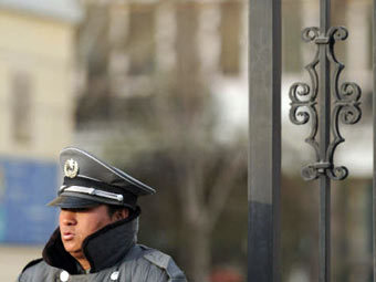 Полиция у дома арестованного китайского диссидента. Архивное фото ©AFP