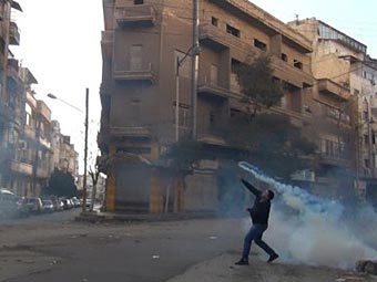 Повстанец в Хомсе. Фото (c)AFP Повстанец в Хомсе. Фото (c)AFP