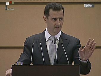 Выступление Башара Асада 10 января 2012 года. Кадр сирийского государственного телевидения, переданный (c)AFP Выступление Башара Асада 10 января 2012 года. Кадр сирийского государственного телевидения, переданный (c)AFP