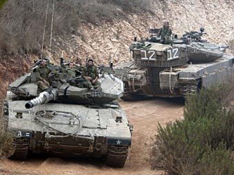 Израильские танки на границе с Ливаном. Фото (c)AFP Израильские танки на границе с Ливаном. Фото (c)AFP
