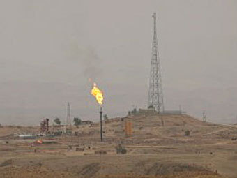 Нефтяное месторождение в Иране. Фото (c)AFP Нефтяное месторождение в Иране. Фото (c)AFP