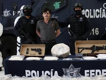 Хайме Геррера в окружении полицейских. Фото (c)AP Хайме Геррера в окружении полицейских. Фото (c)AP