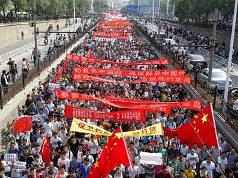 Антияпонская акция в Чжэнчжоу. в Фото (c)AFP Антияпонская акция в Чжэнчжоу. в Фото (c)AFP