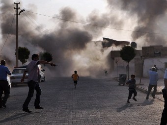 Город Акчакал после падения сирийских снарядов. Фото (c)AFP Город Акчакал после падения сирийских снарядов. Фото (c)AFP